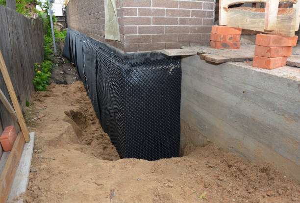 Happy homeowners after waterproofing job in Midland